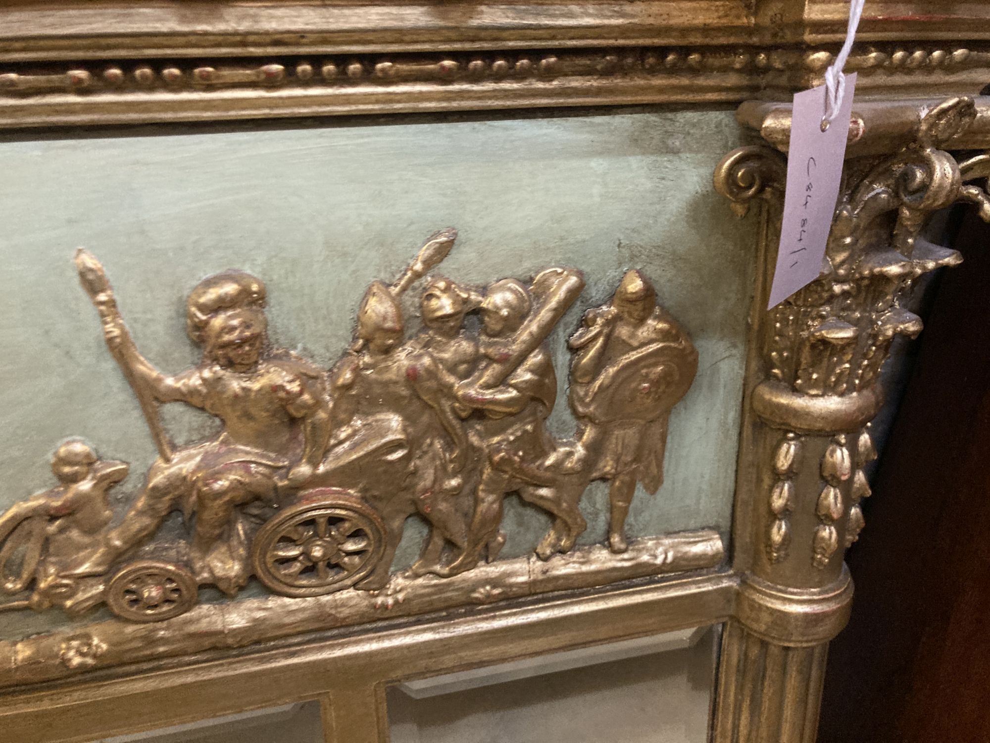 A large Regency carved giltood and gesso triple plate overmantel mirror, width 152cm, height 96cm